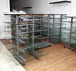 Adjustable glass shelving
