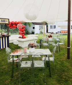 Glass and Chrome Leg Tables in marquee setting