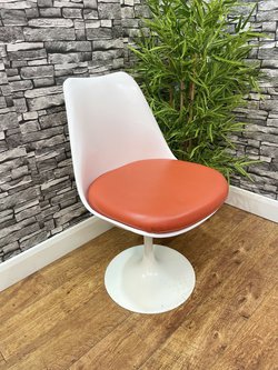 White and orange dining chairs