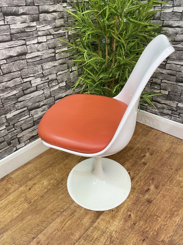 White tall backed swivel chairs