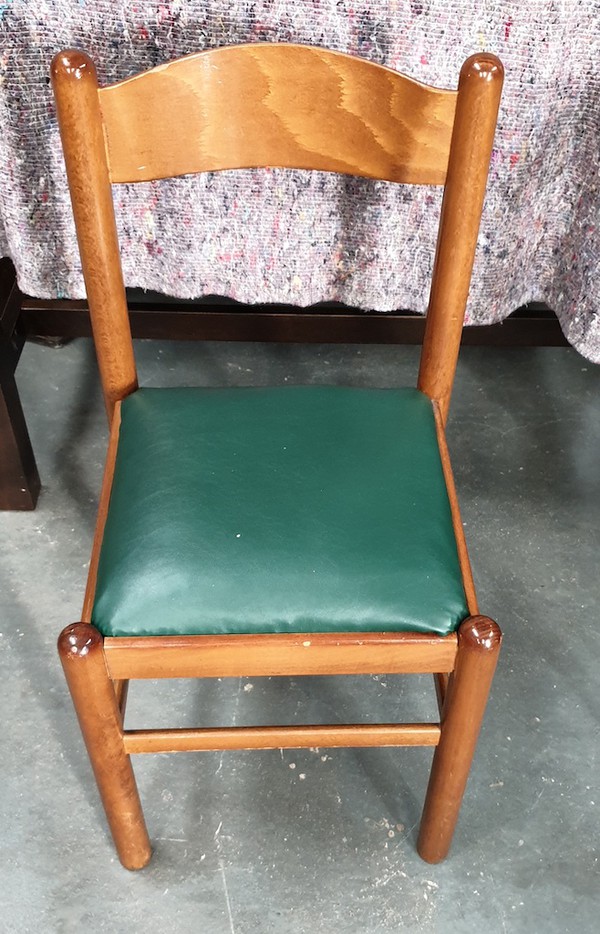 Wooden dining chairs with green seat