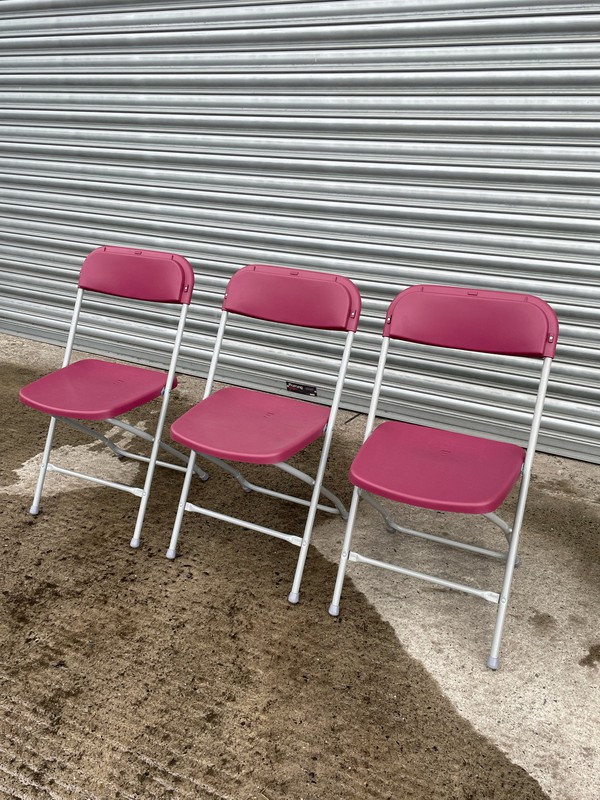 Folding maroon chairs with grey frame