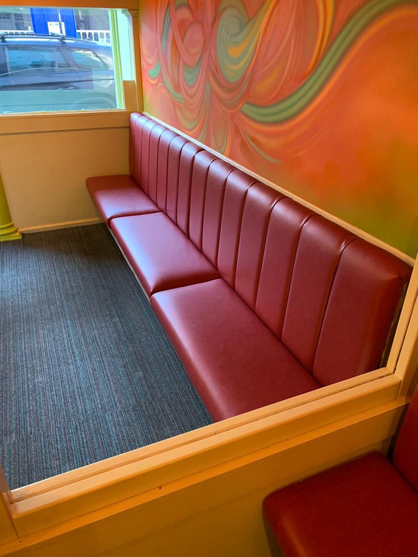 Red restaurant bench seating
