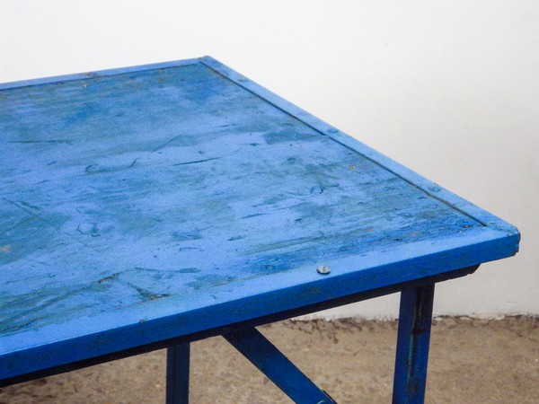 Blue folding trestle table