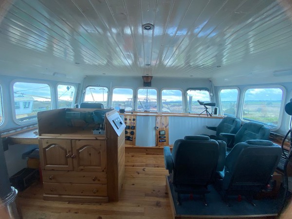 Trawler wheel house with comfy chairs and fantastic view