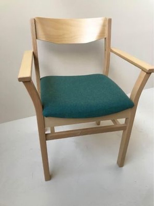 stacking beech armchair in a light oak stacking beech armchair in a light oak