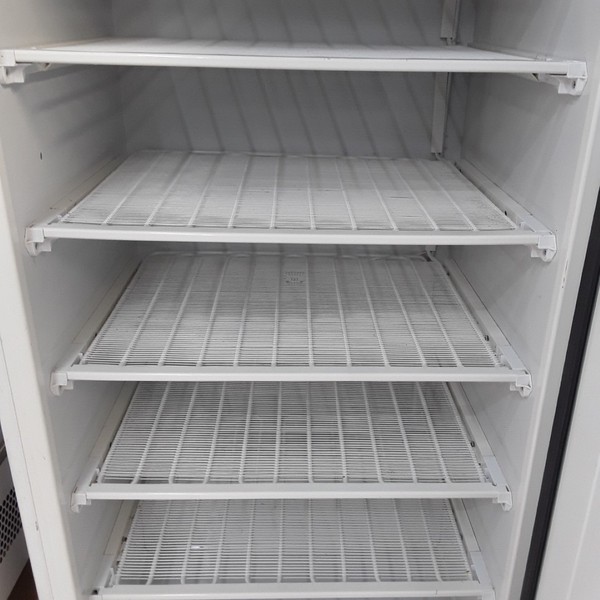 Commercial freezer with fixed shelves