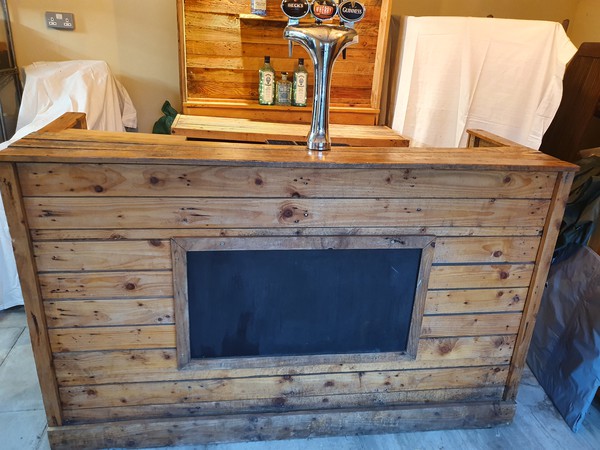 Mobile rustic bar with bar equipment