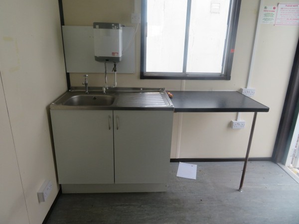 Stainless steel sink with water heater