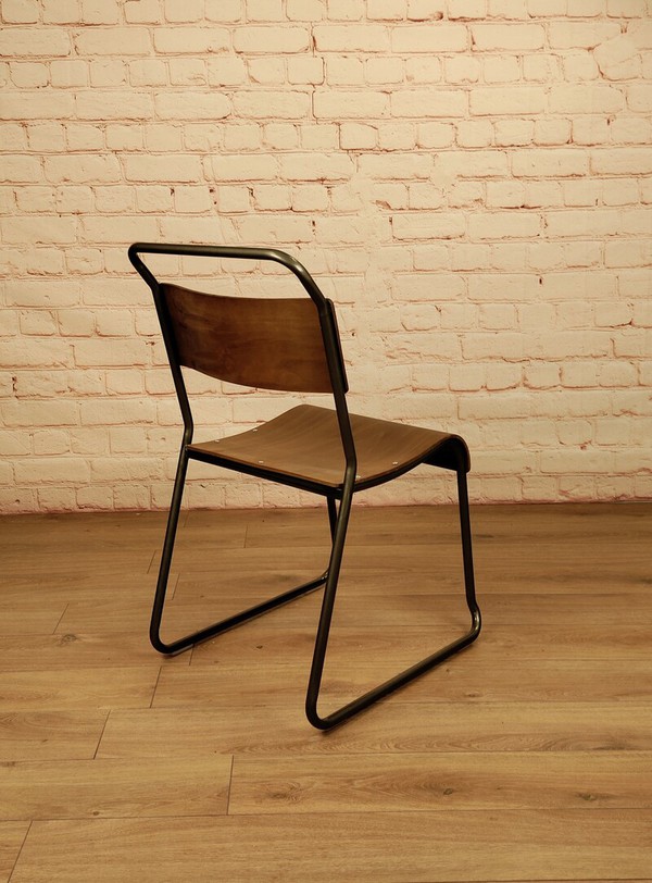 Stacking chairs with steel frames and plywood seats