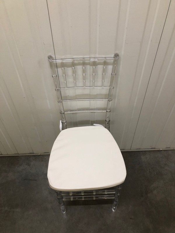 Ghost chairs with white seat pads