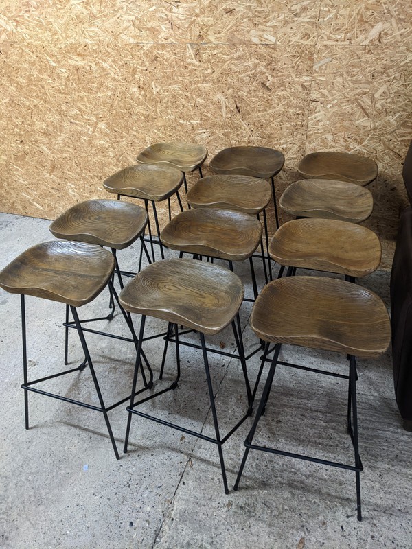 Ergonomic Stained Oak Bar Stools with Black Metal Legs For Sale