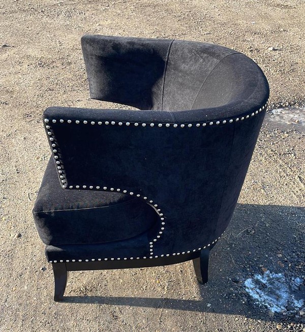 black curved armchairs