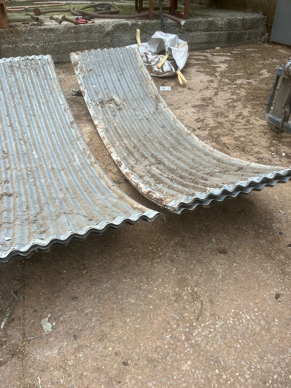 Curved corrugated steel sections