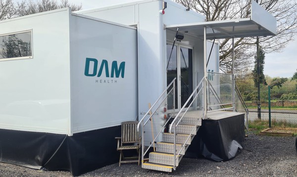 Articulated exhibition trailer with slide outs