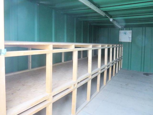 Tool storage shelves in secure container