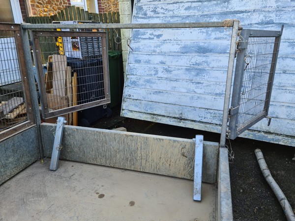 Drop side trailer with cage sides