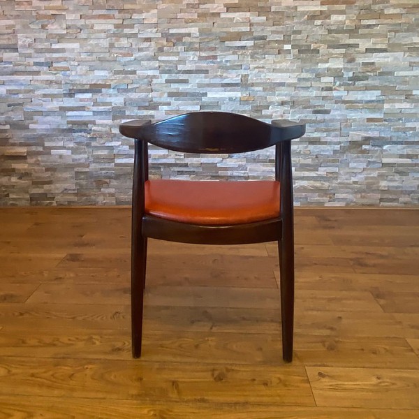Vintage Real Orange Leather Chair seated on a Dark Oak Frame with curved back