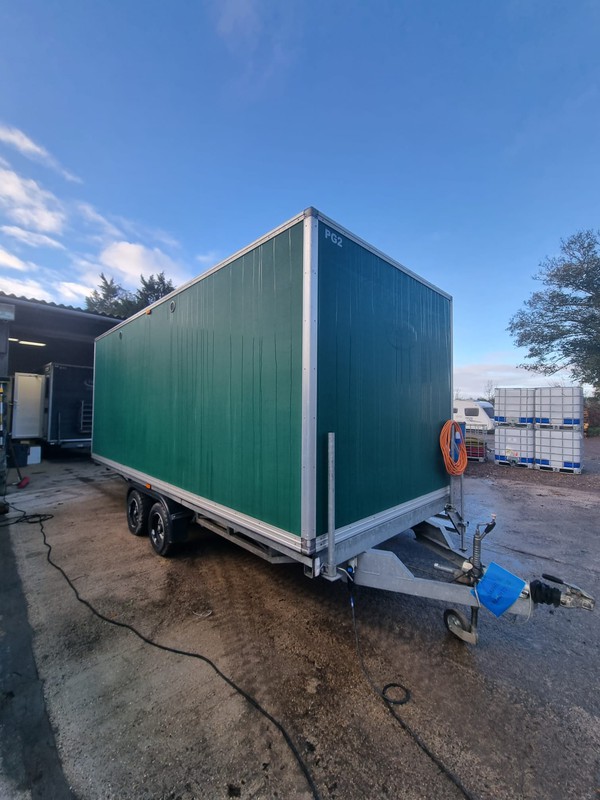Luxury toilet trailer with urinal troughs