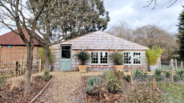 Marquee building with rustic cladding