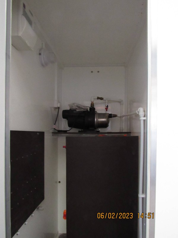 Service cupboard and water pump
