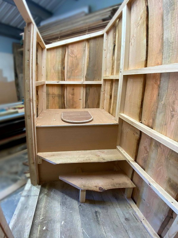 Composting toilet with steps