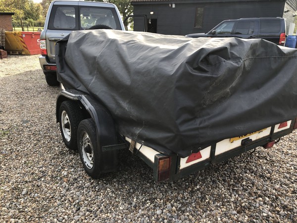 Twin axle trailer with cover