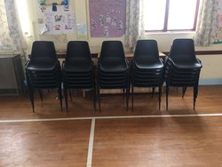 Black plastic stacking chairs