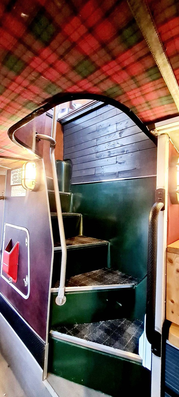 Stairs to the top deck of the glamping bus