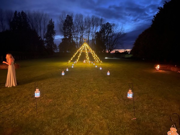 Tipi poles decorated at night