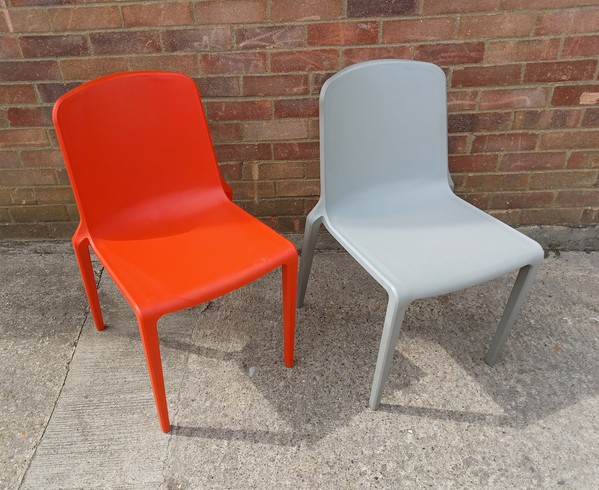Orange and Grey Plastic stacking chairs