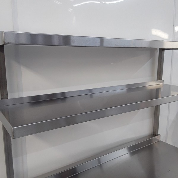 Shelves above stainless steel table