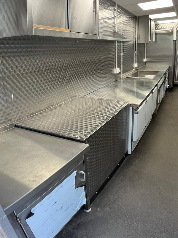 Catering truck with brushed stainless steel work surfaces