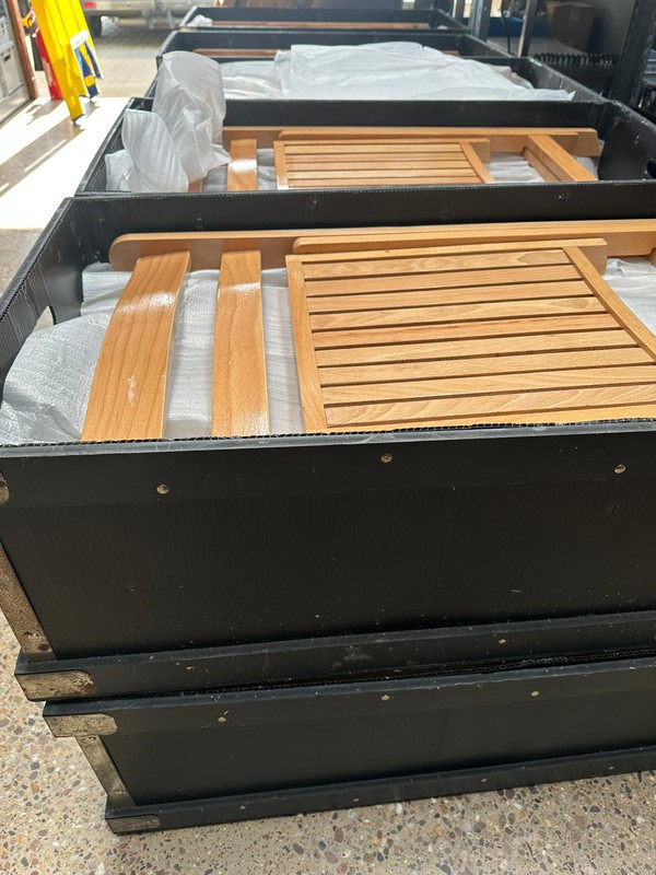 Folding wooden chairs in transport boxes