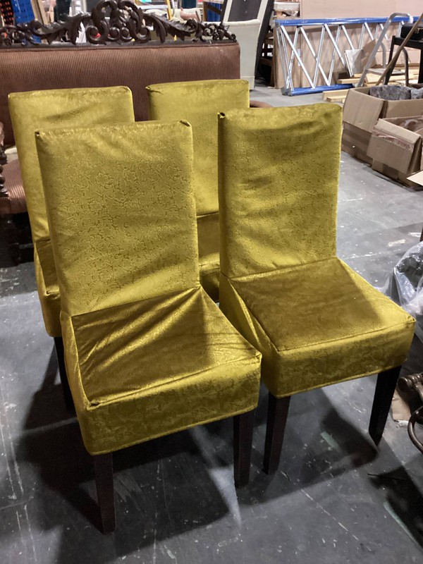 Dining chairs with gold covers