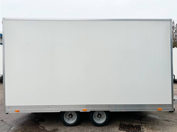 Twin axle white exhibition trailer