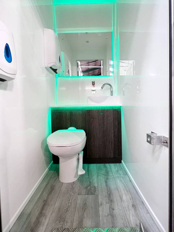 Toilet cubicle with colour changing lights