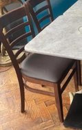 Wooden chairs with brown seat