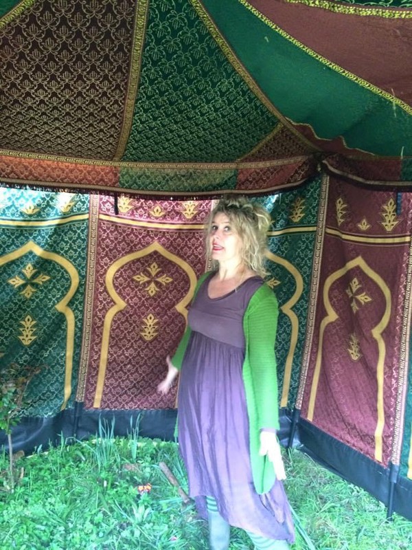 traditional red, green and gold patterned fabric marquee