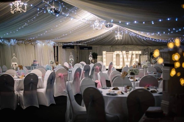 Marquee at night with Love letters