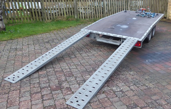Car transport trailer with long ramps