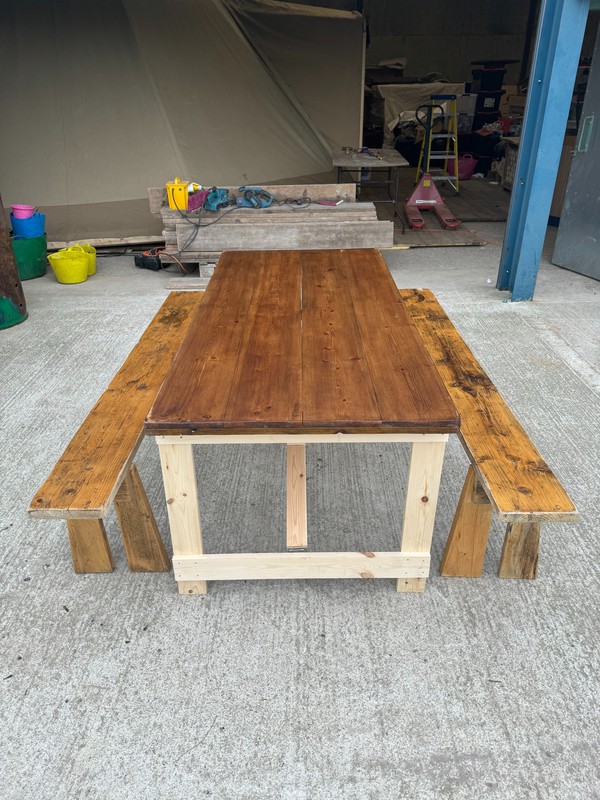 Rustic trestle tables and benches
