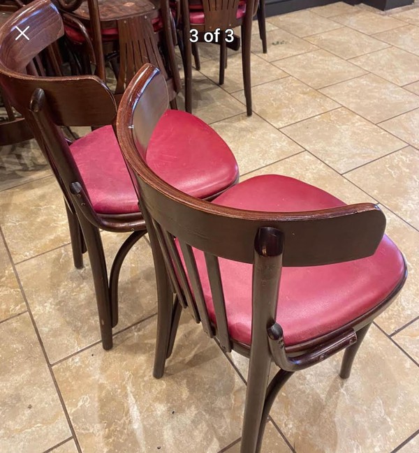 dark wood chairs with red seat