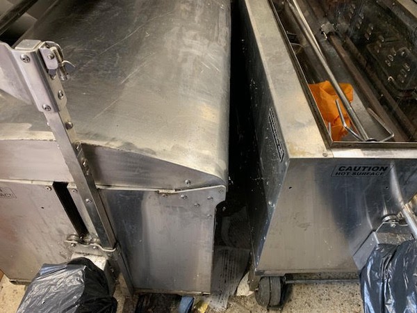 Pair of tasty trotter hog roast machines