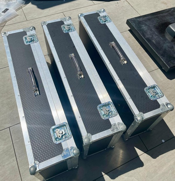 3x Flight cases each with two bars of lights