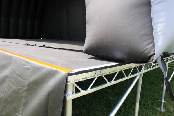 Inflatable stage roof installed on top of stage decks