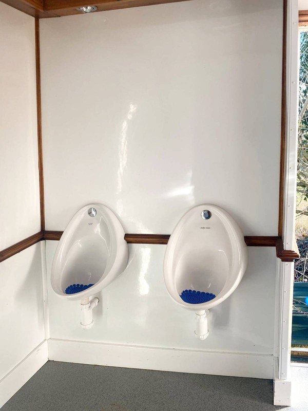 Toilet trailer with urinals