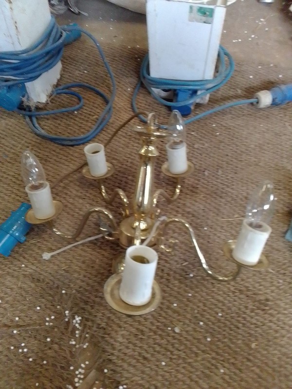 Chandeliers wired up for marquees