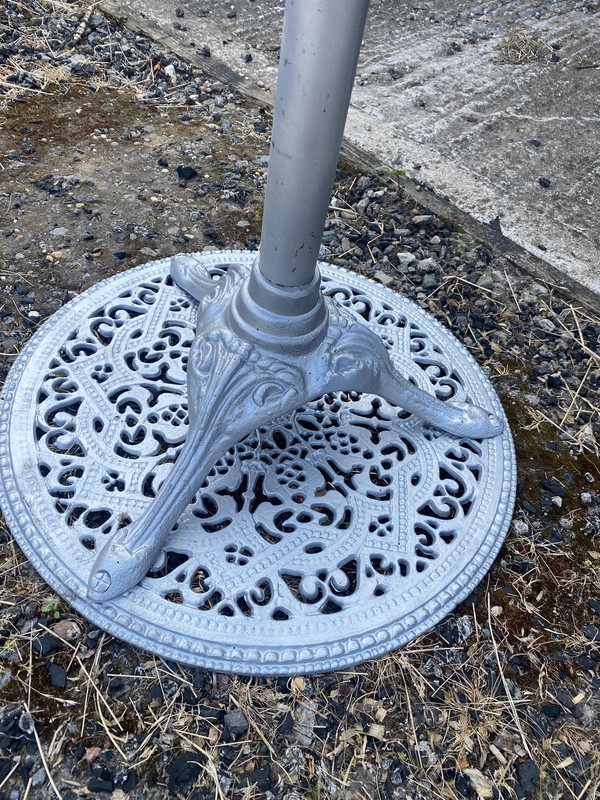 Poseur tables with cast iron bases