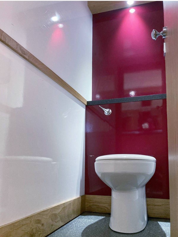 Burgundy and white toilet trailer interior